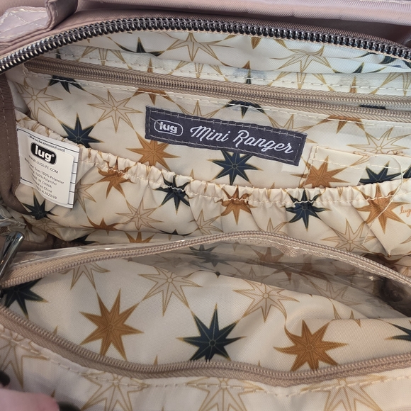 Lug Ranger Mini Crossbody Bag in a mauve or cappuccino color. - Picture 5 of 9